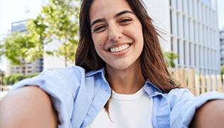 Optious subscription imgs 0000 vertical selfie young smiling woman university campus cheerful student posing outdoors