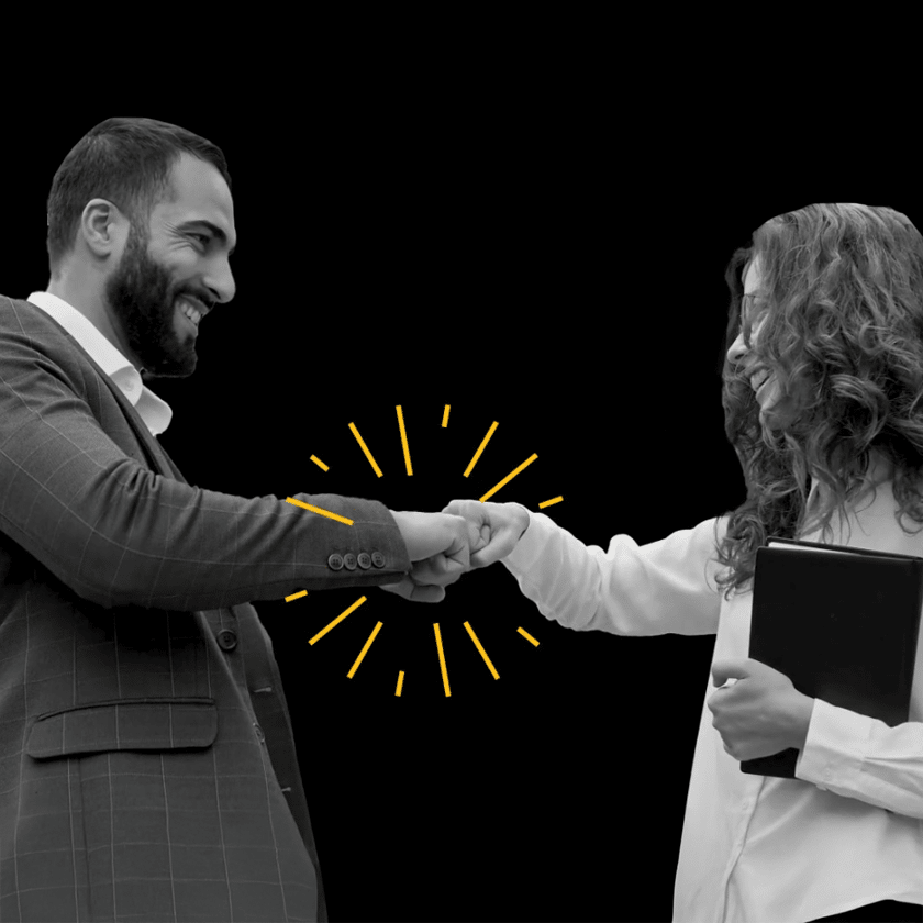 Brand video showing two professionals shaking hands on black background
